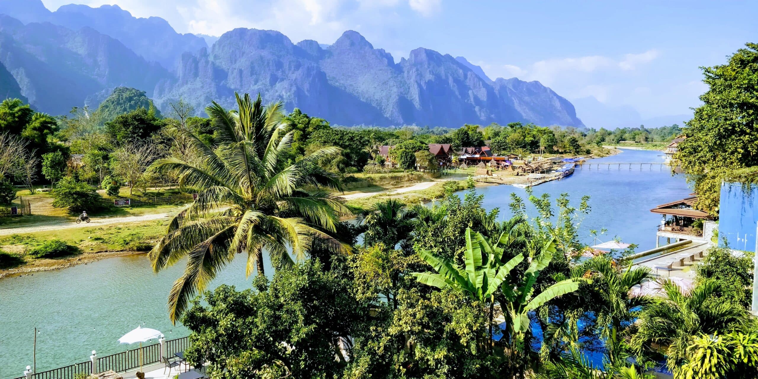 Views of the Mekong River amongst the palm trees in Laos