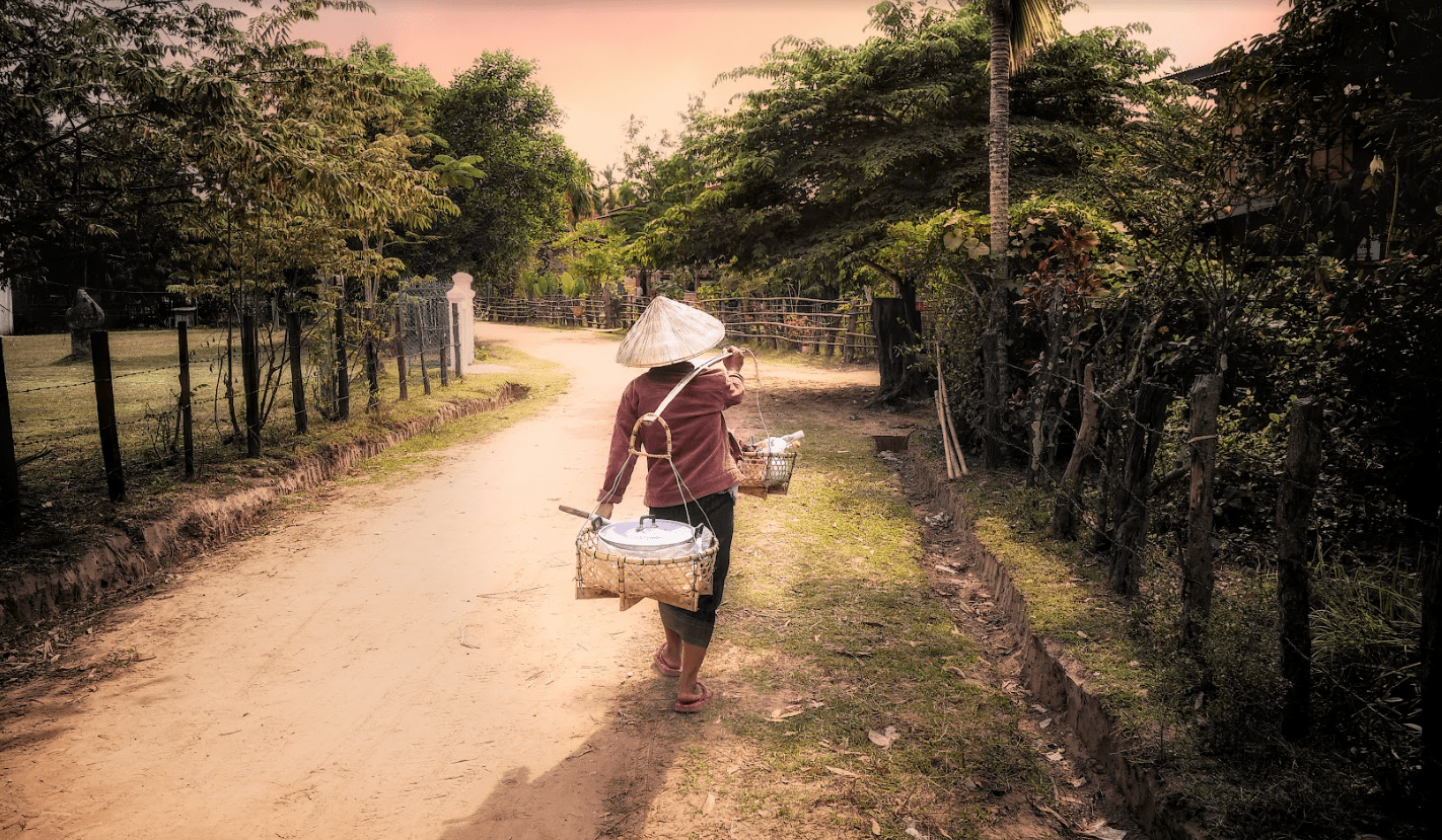 Food being carried on traditional equipment in Laos