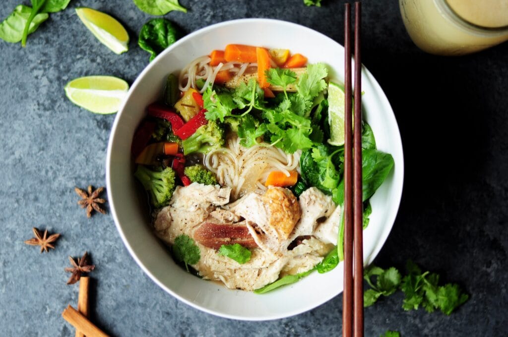 Bowl of traditional Vietnamese Pho with chopsticks.