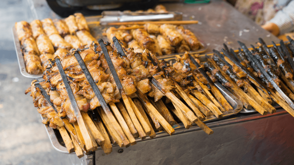 Char-grilled pork on a barbecue from a street vendor in Vietnam.