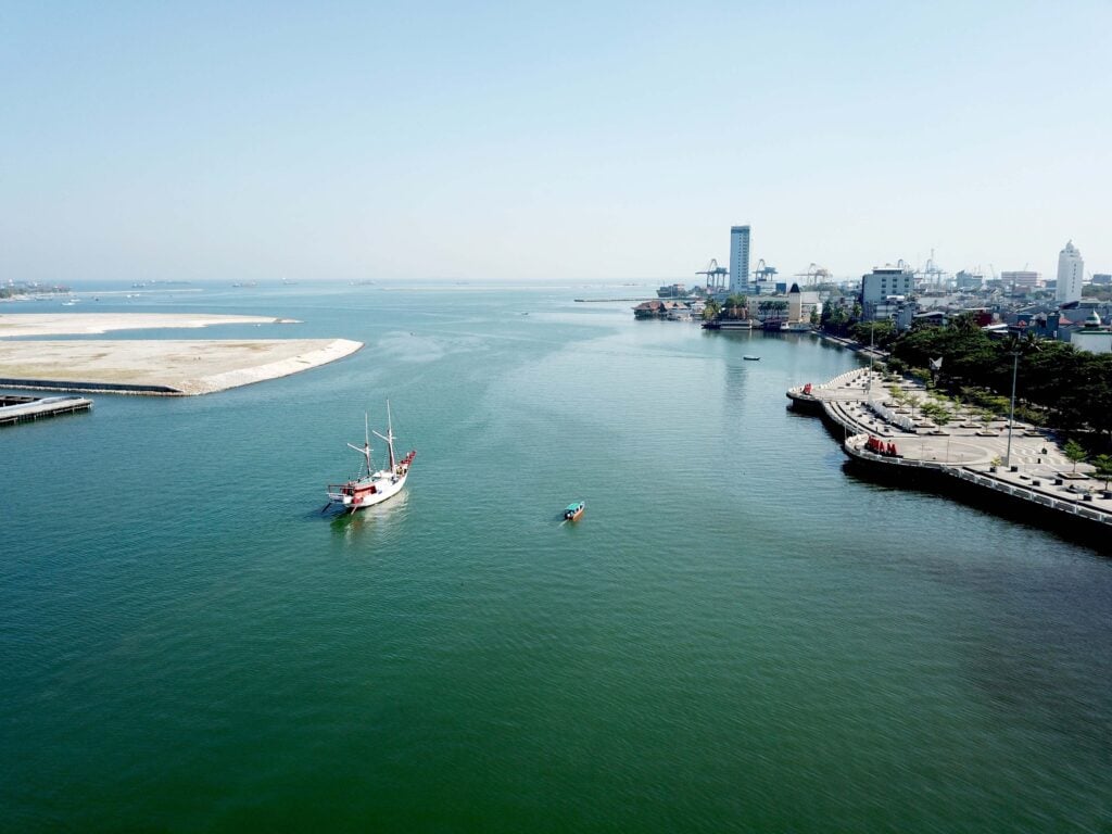 Aerial view of a boat approaching Makassar port