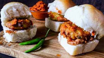 Three Vada Pav Indian style patty in a bun