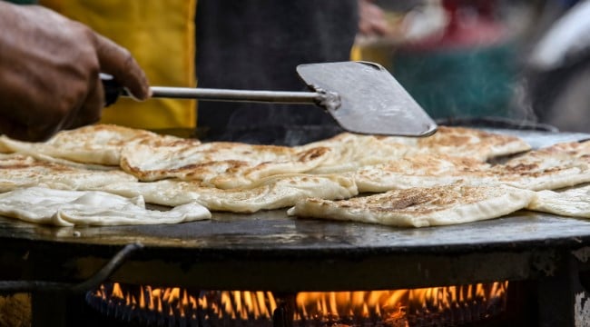 Akki Roti Indian Rice Bread being cooked over flames