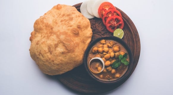 Plate of Chhole Bhature, an Indian chickpea curry served with deep-fried bread