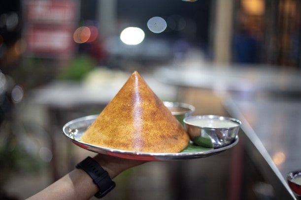 A silver plate of Dosa - an Indian street food classic
