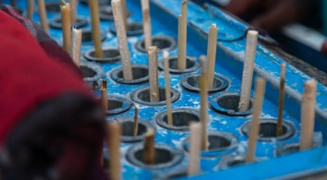 A cart of Kulfi (Indian Ice cream) with the sticks poking out