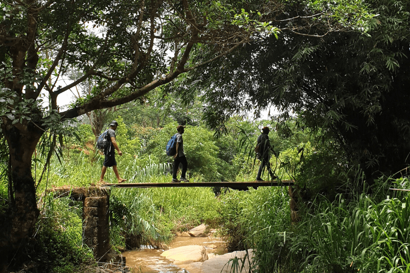 Our location manager Thushni walking the Pekoe Trail with guides in Sri Lanka
