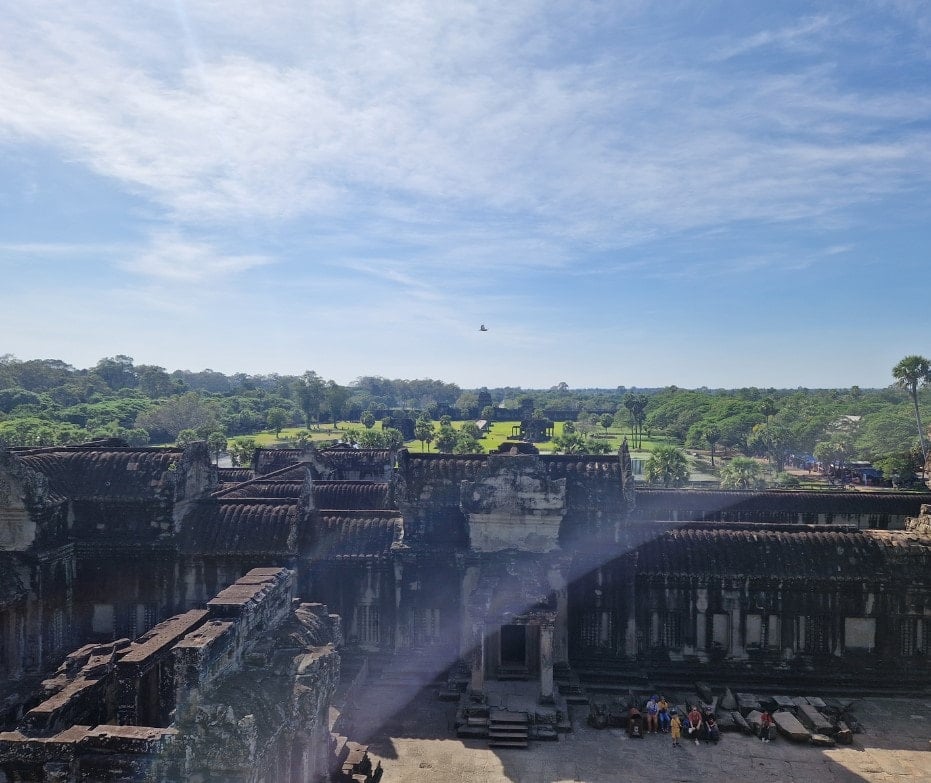 View from the central spire of Angkor Wat over the green grounds.