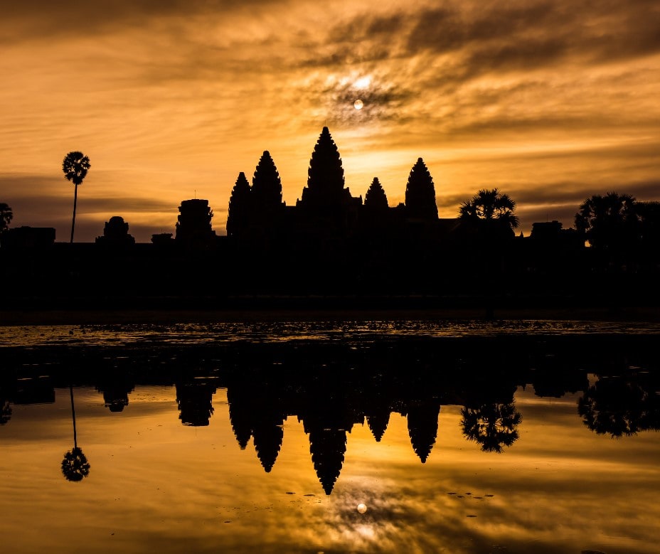 The silhouette of Angkor Wat at sunrise.