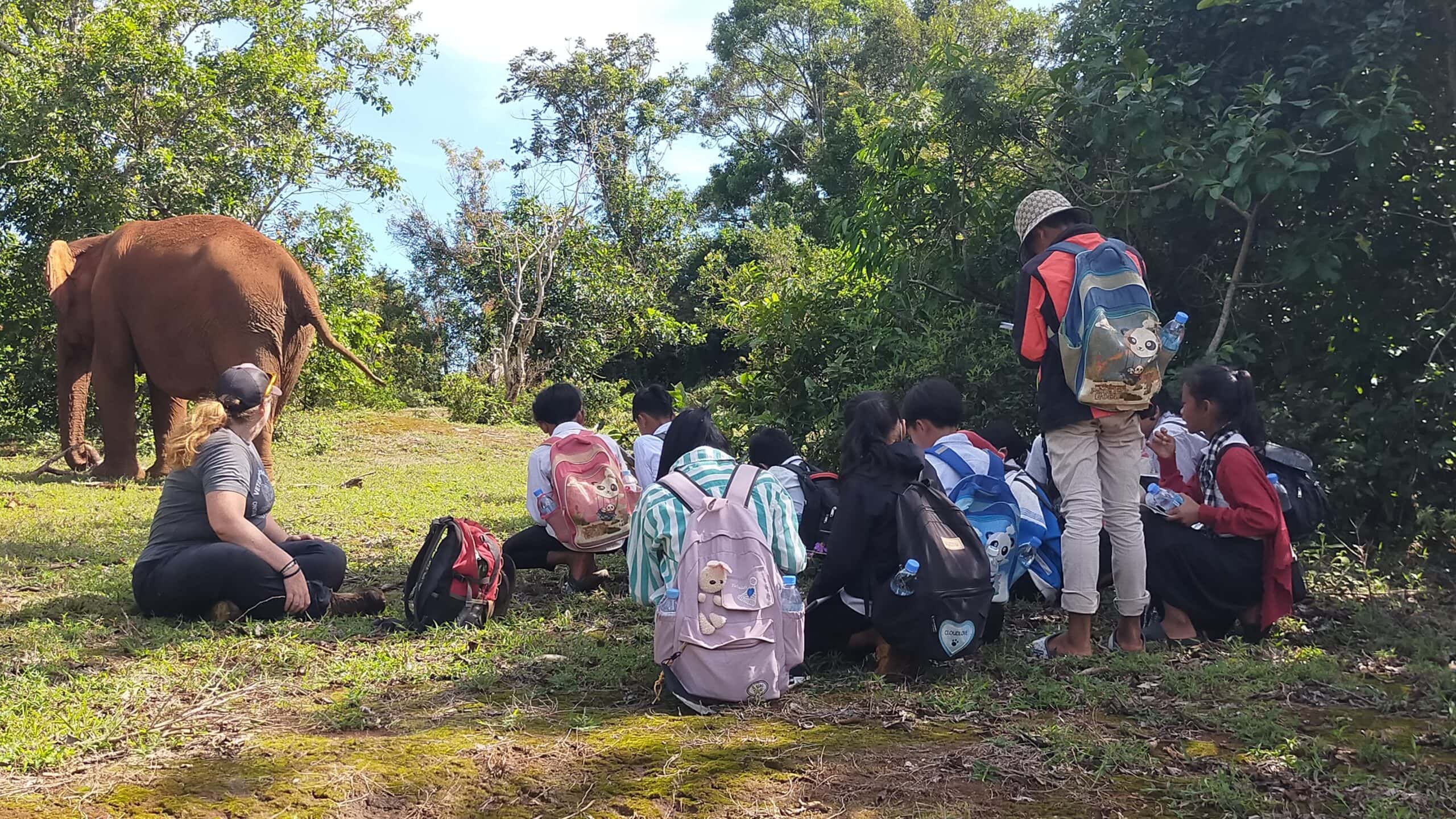 A group of share the wonder kids get up close with an elephant at Elephant Valley Project in Cambodia