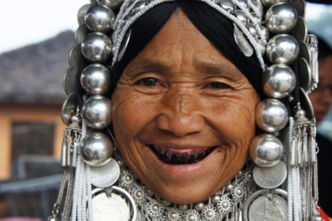Tribal Akha Woman in Traditional Headdress