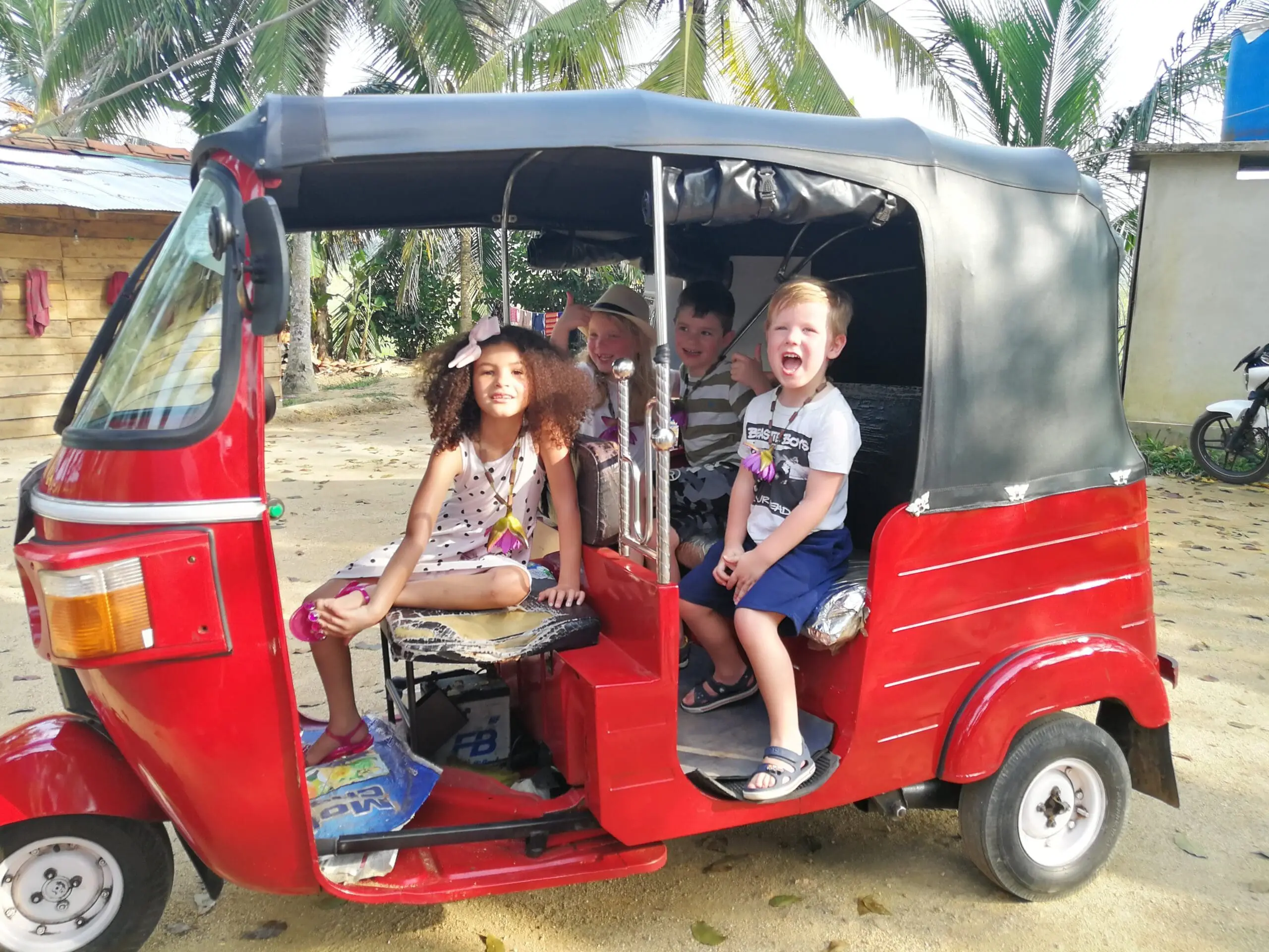 Family in tuk tuk sri lanka