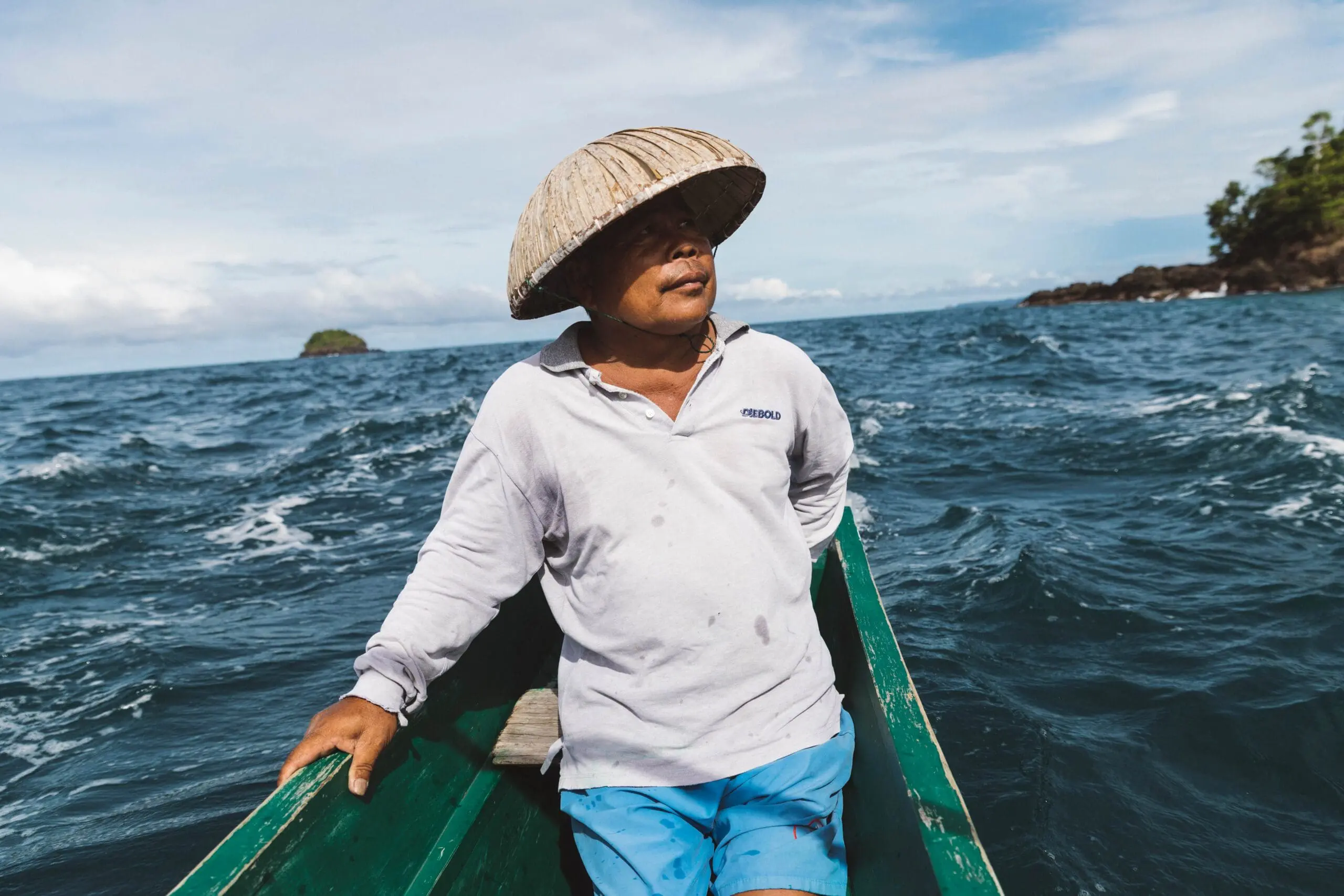 Local man crossing sea in Indonesia