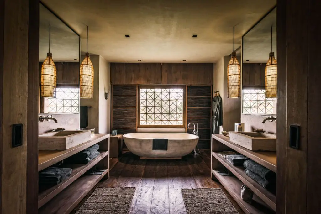 Luxury bathroom interior at Phum Baitang resort Cambodia with freestanding bath