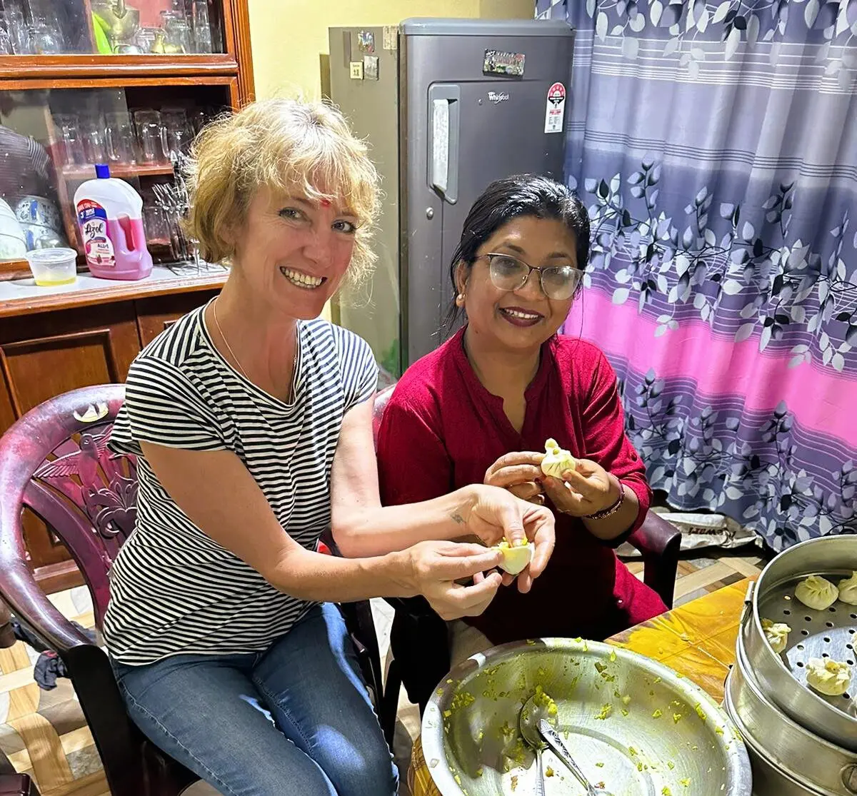 Sara Wells learning to make momos with a local cook in Panauti, Nepal, 2024