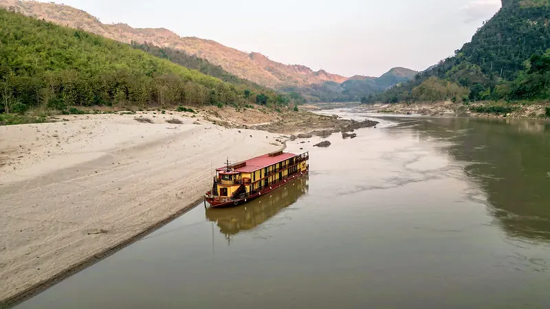Mekong River cruise landscape in Laos with mountains and sandbanks