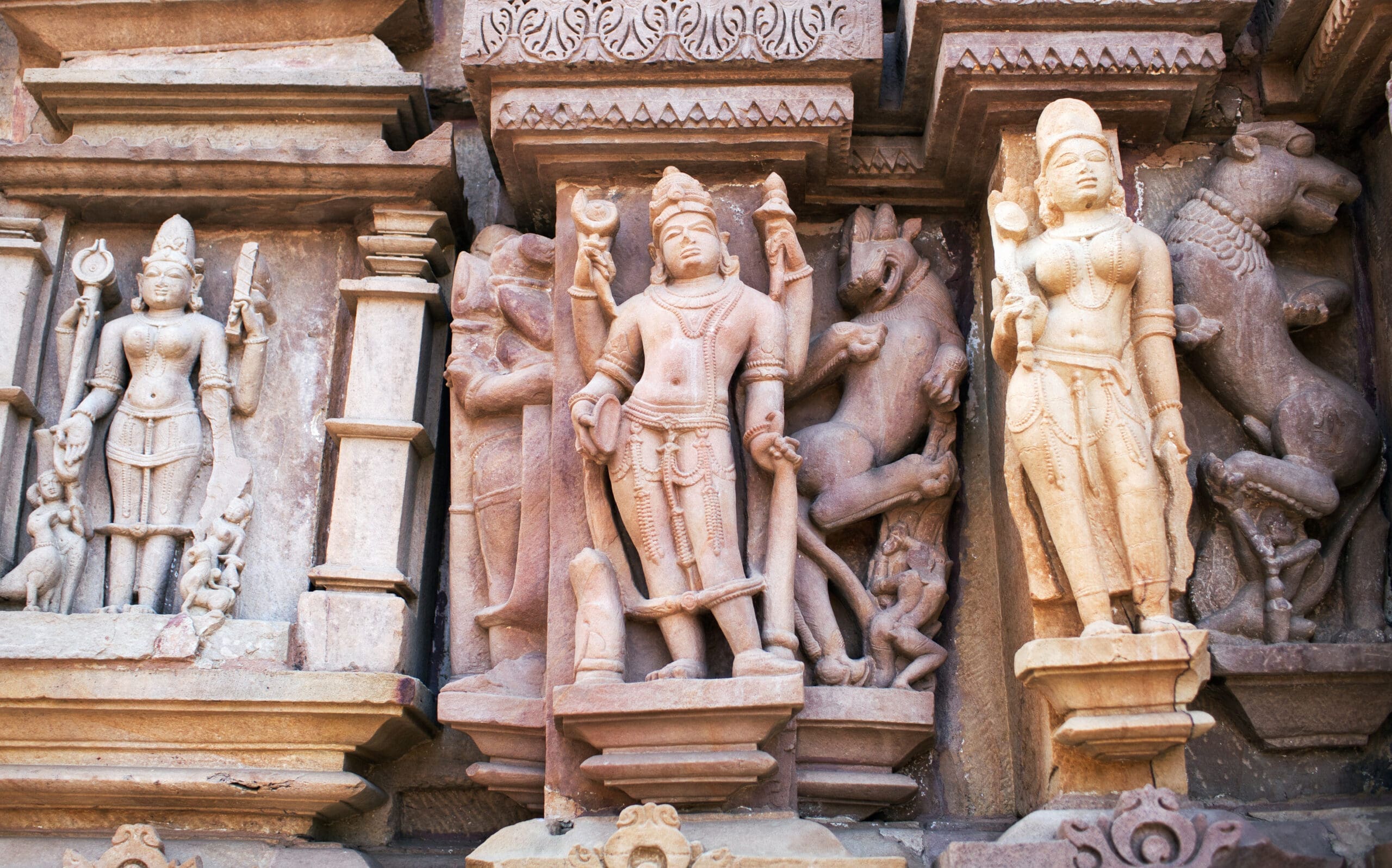 Bas-relief at famous ancient temple in Khajuraho, India. Most Khajuraho temples were built between 950 and 1050 by the Chandela dynasty.