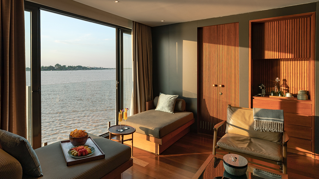 Spacious interconnecting suite on Aqua Mekong with floor-to-ceiling river views and lounge area