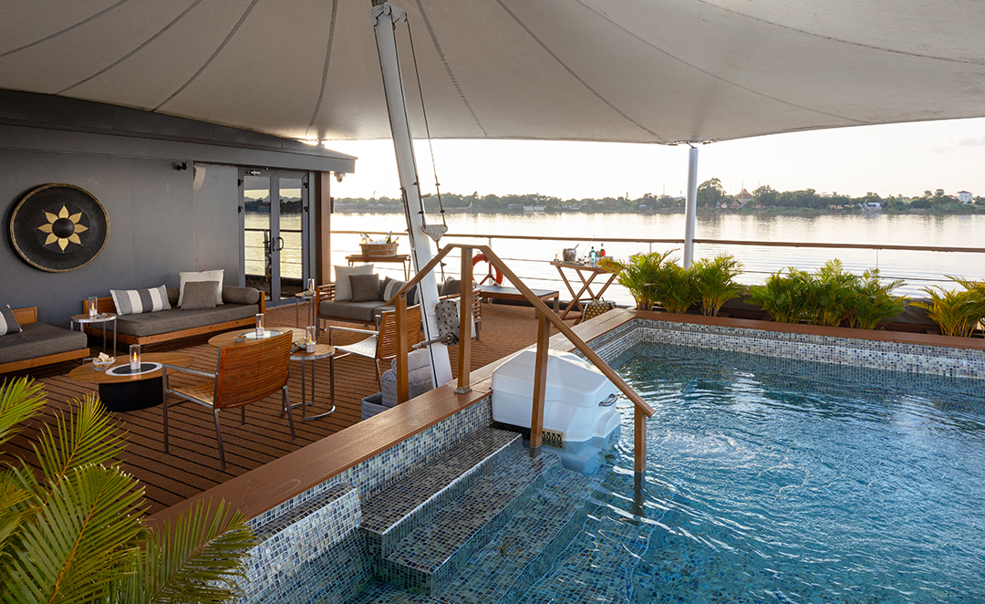 Plunge pool and lounge area on Aqua Mekong cruise deck with river views