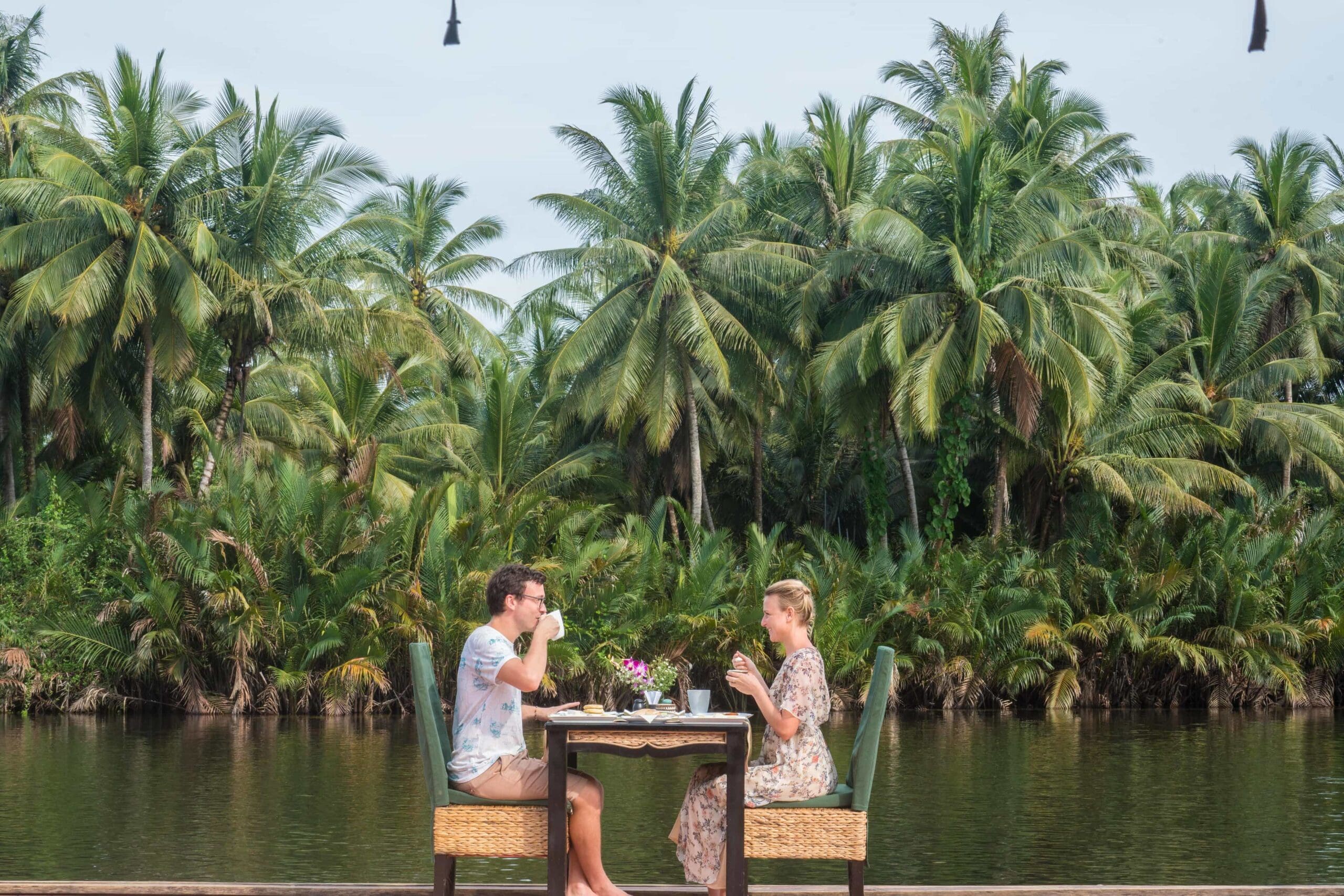 Canvas and orchids dining on the river