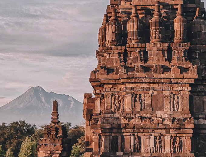 Detail of Prambanan temple with Mount Merapi in the background, Java