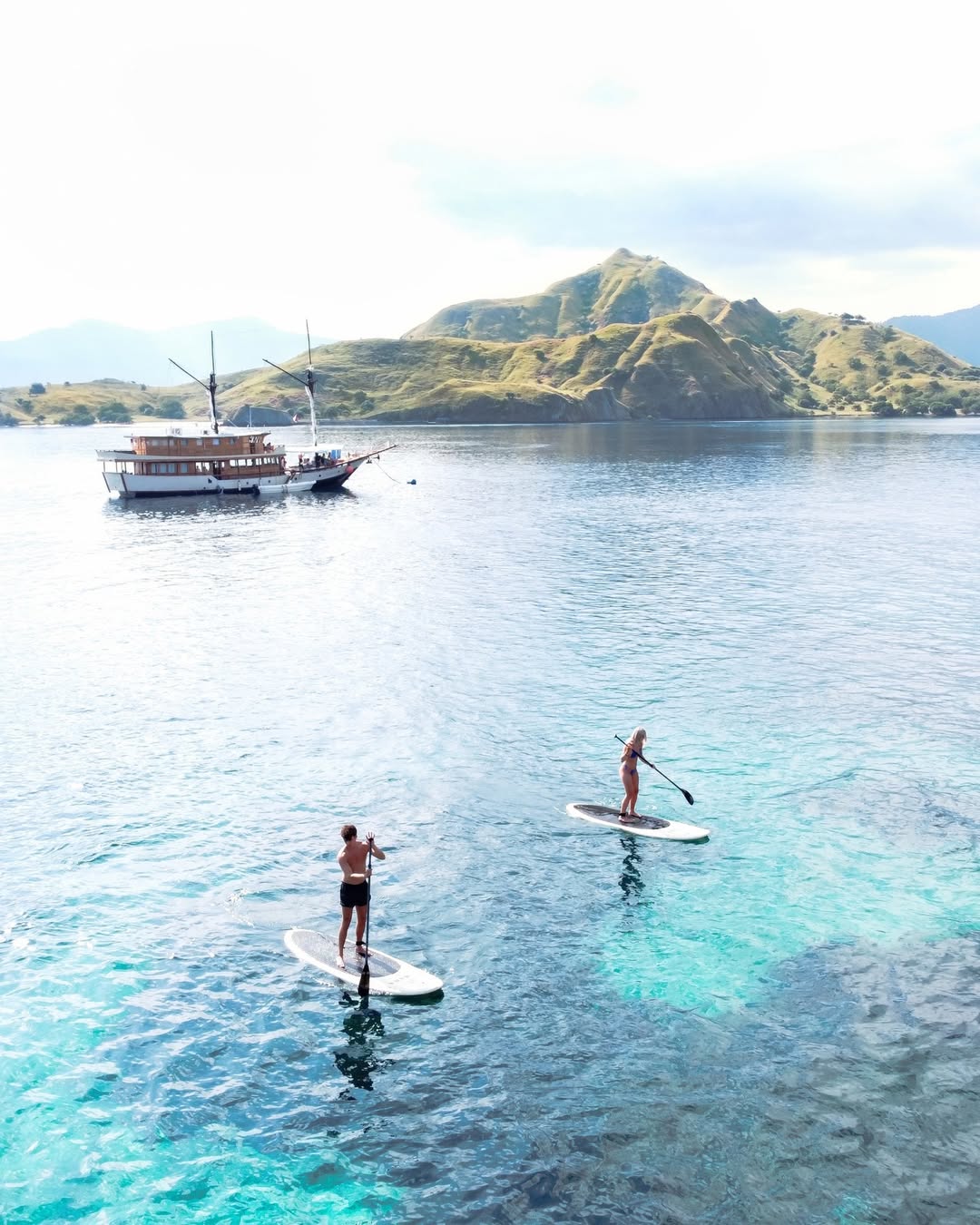 Paddle boarders in Komodo aboard Samara