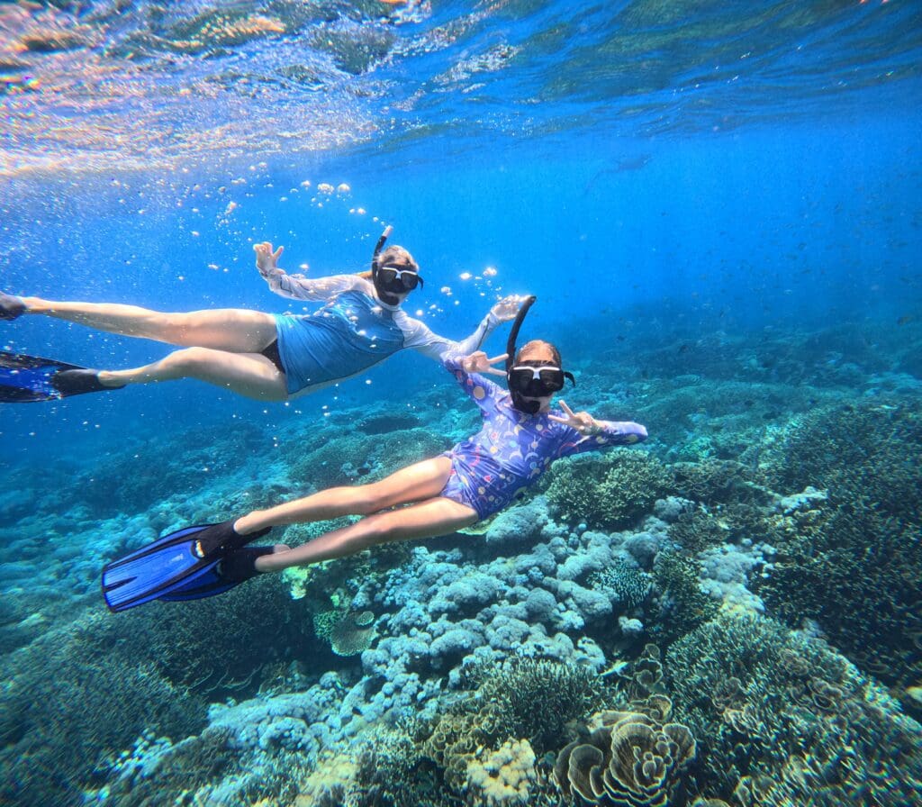 Two teens snorkelling Komodo Indonesia