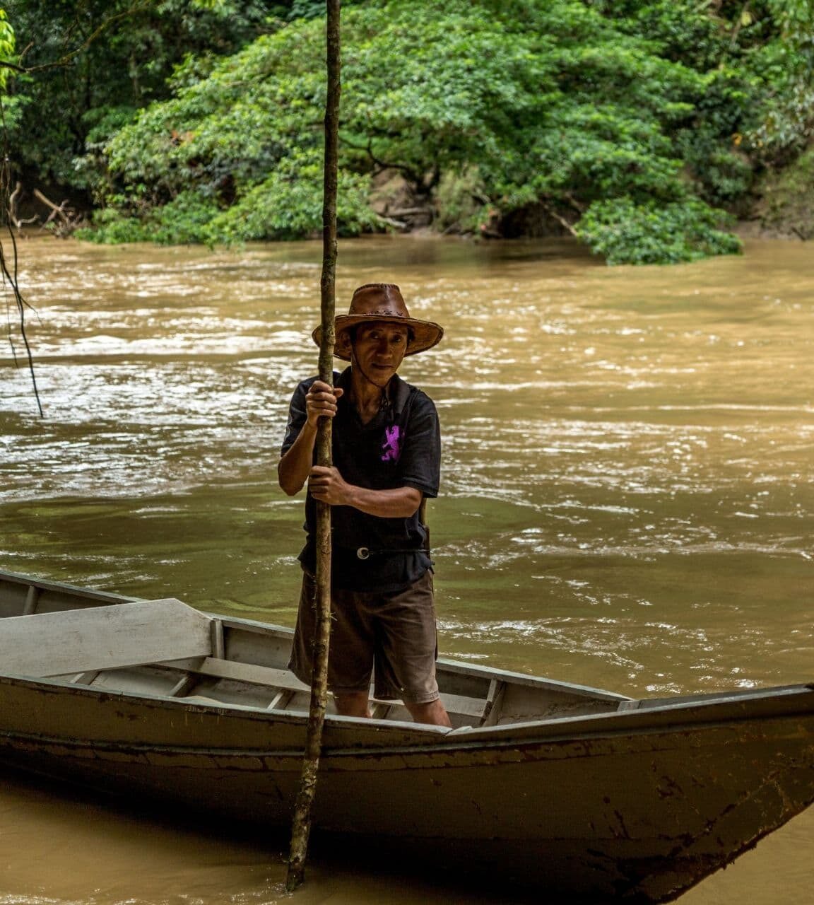 Local guide on a river in Borneo during a wildlife excursion
