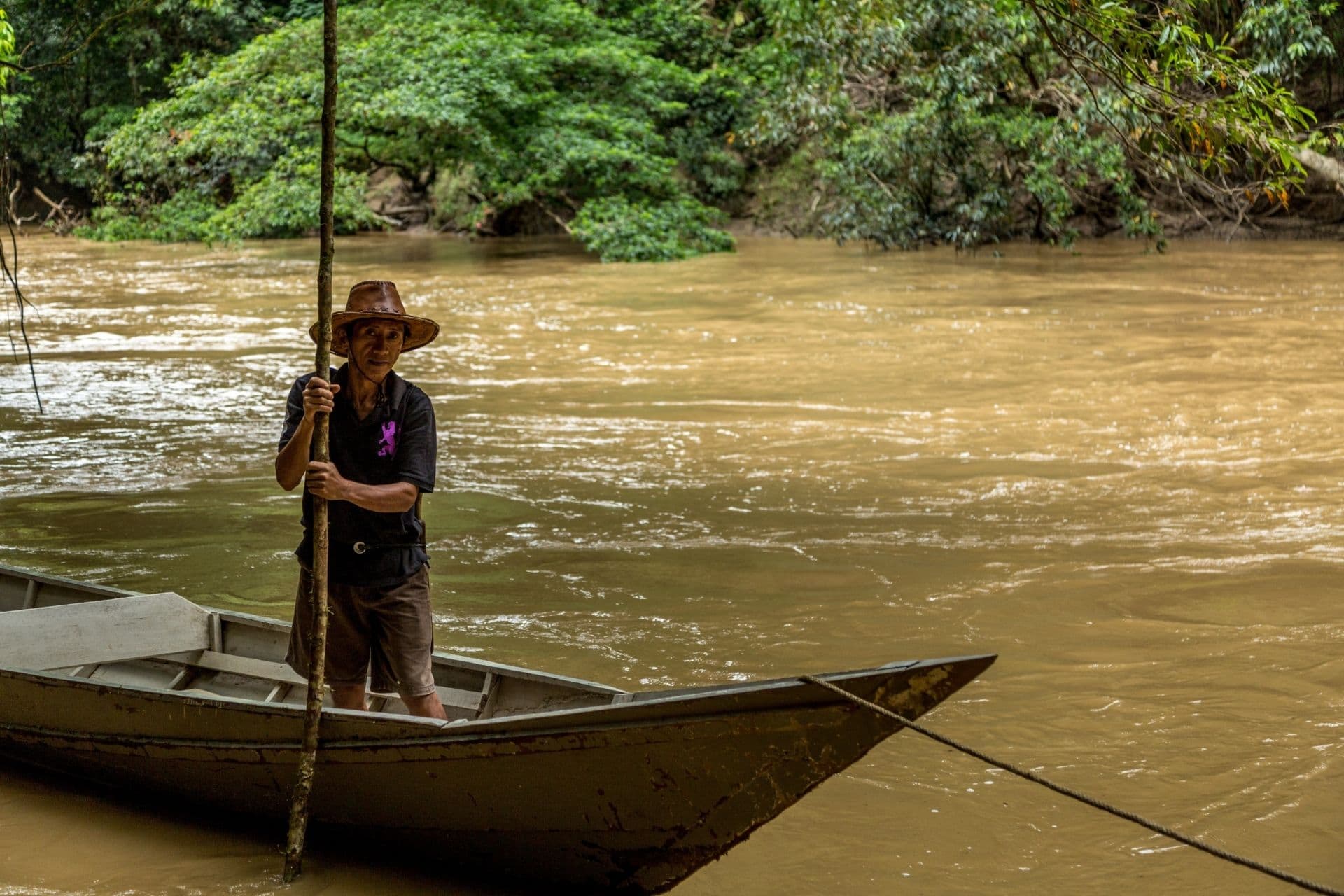 Local guide on a river in Borneo during a wildlife excursion