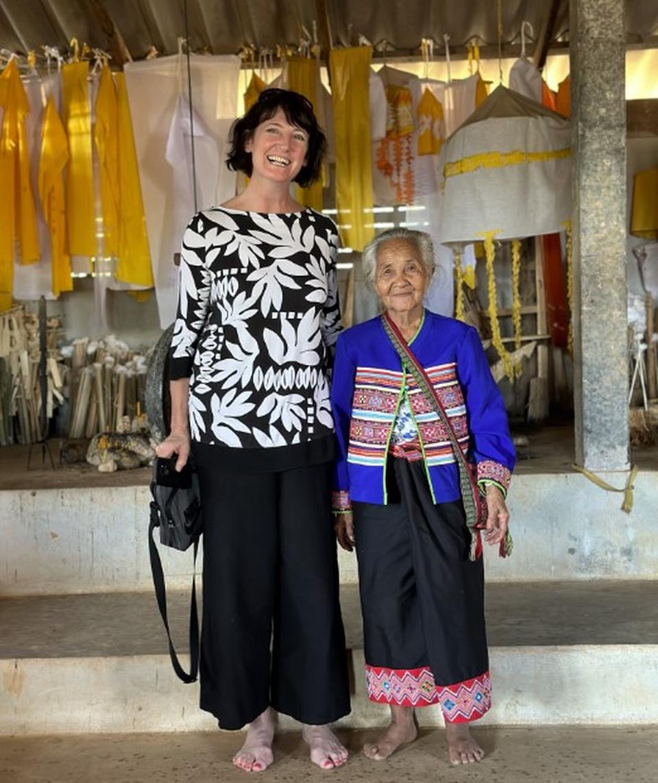 Sara Wells, ETG travel consultant, with a local woman at a temple in Thailand
