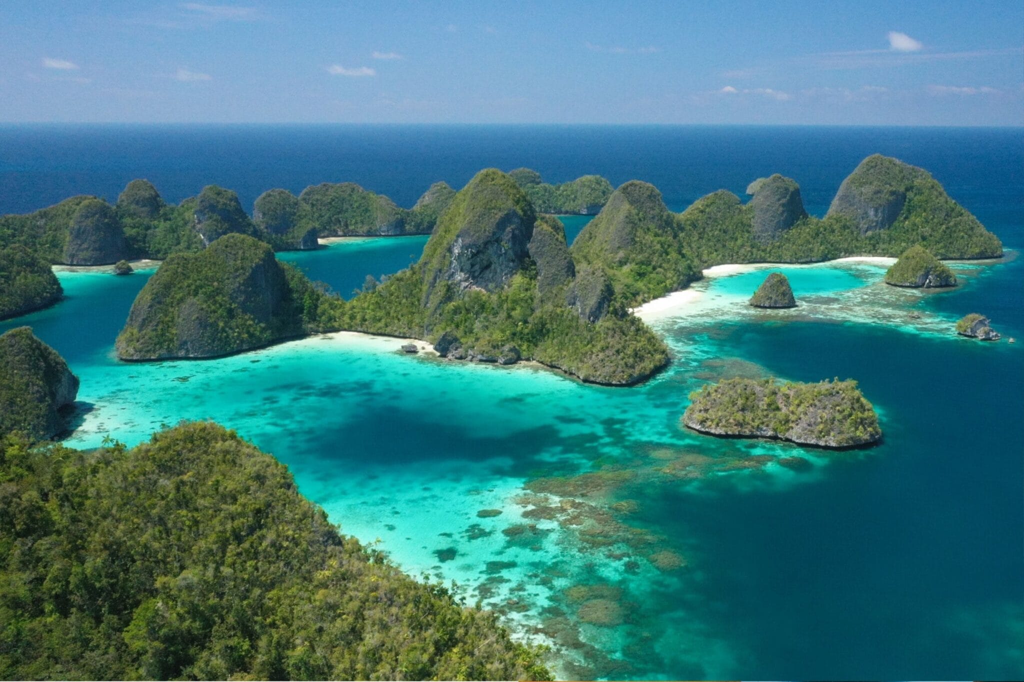 Aerial view of Raja Ampat islands with turquoise water and limestone karsts in Indonesia