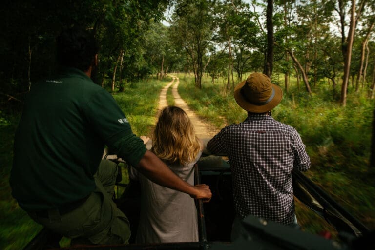 Safari jeep experience in Sri Lanka national park with travellers and guide