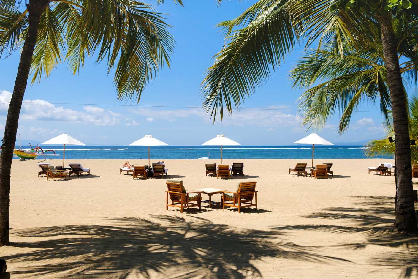 Traditional pavilion by the pool surrounded by tropical gardens at Tandjung Sari Sanur