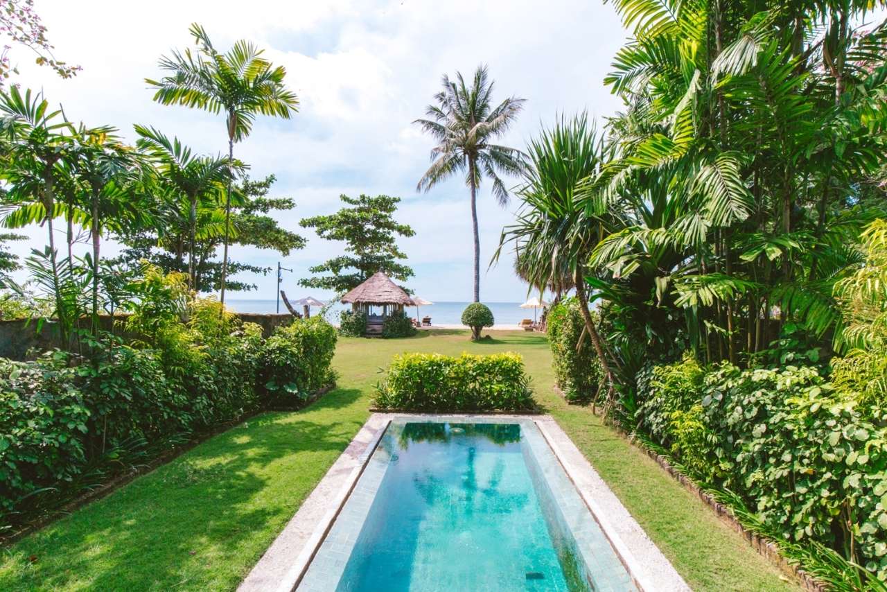 Private pool villa at Tugu Lombok with tropical garden and beach beyond